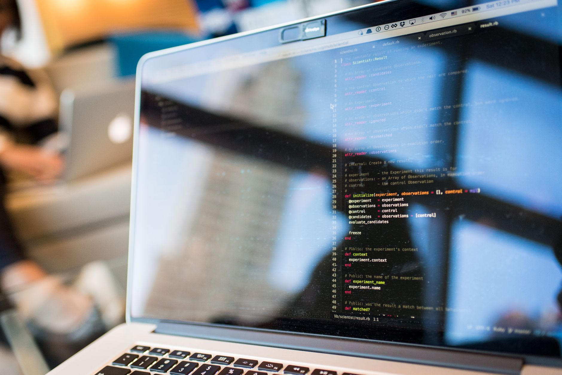 Developer integrating API-driven payment infrastructure on laptop in modern office